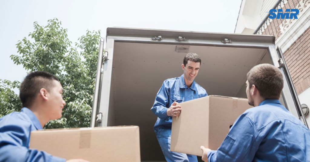 Man and van Dalston team loading furniture into a van for a house move in London
