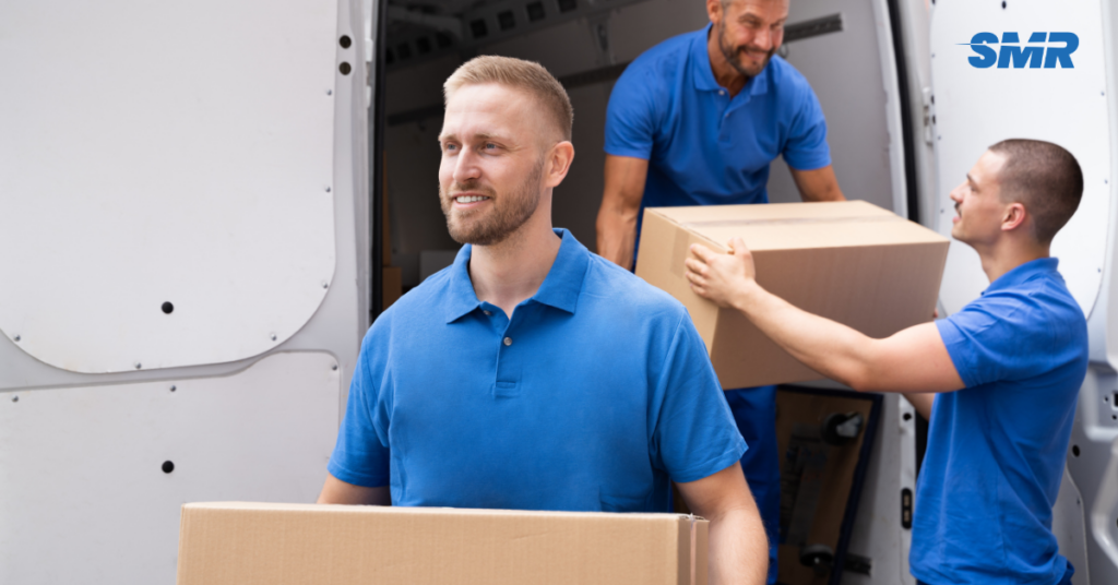 Man and van Daptford team loading a van with furniture for a house move in London