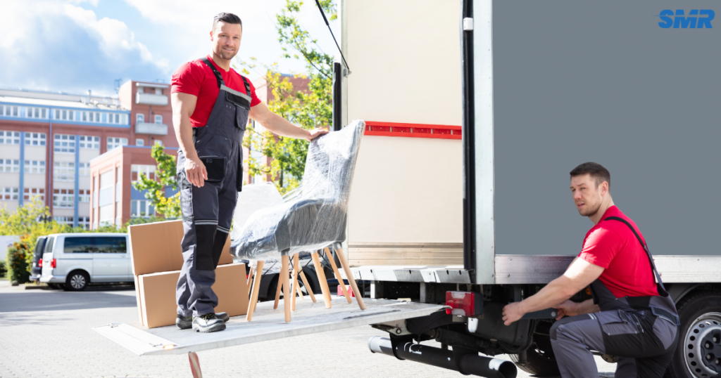 cheap man and van Finsbury same day removals service with movers loading furniture into van