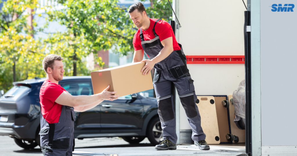 house removals Finsbury with movers assisting in loading boxes and furniture