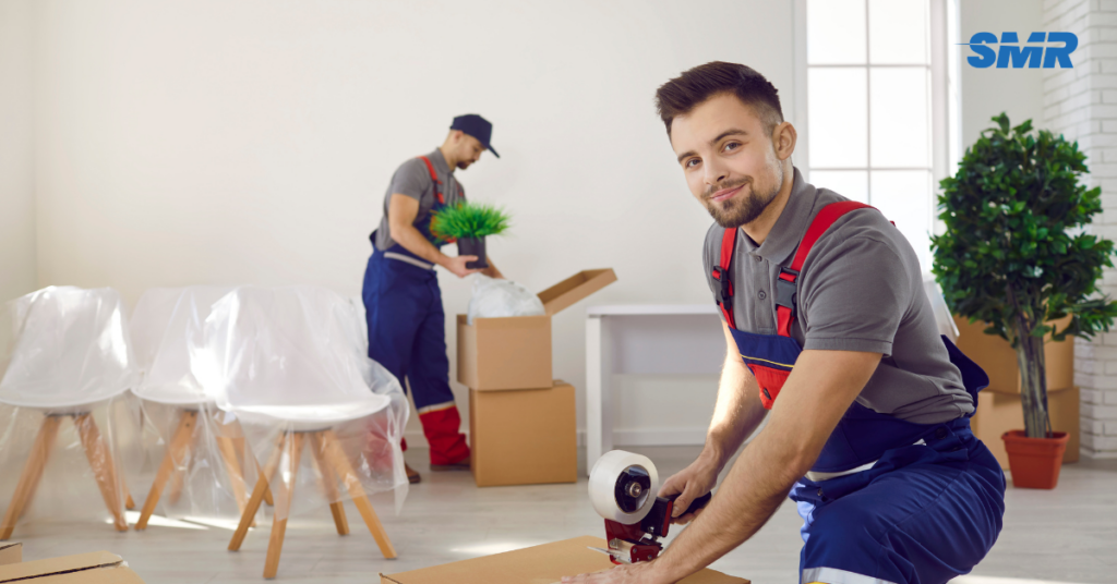 Professional movers carrying furniture during a house or flat move in Southwark
