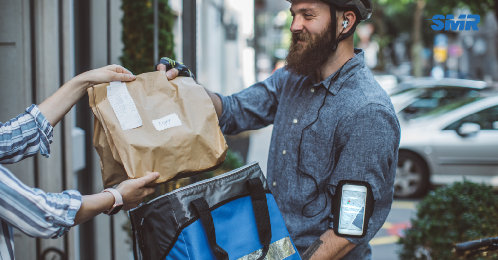 Man and van for single item Lambeth delivery service with mover carrying parcel