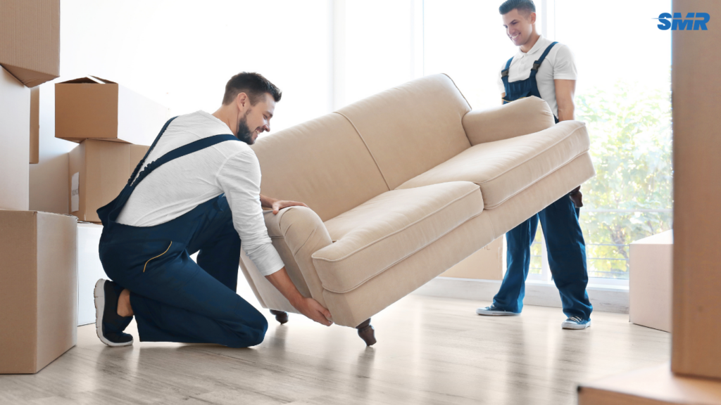 Man with a van in West Drayton moving a large sofa for a single item removal