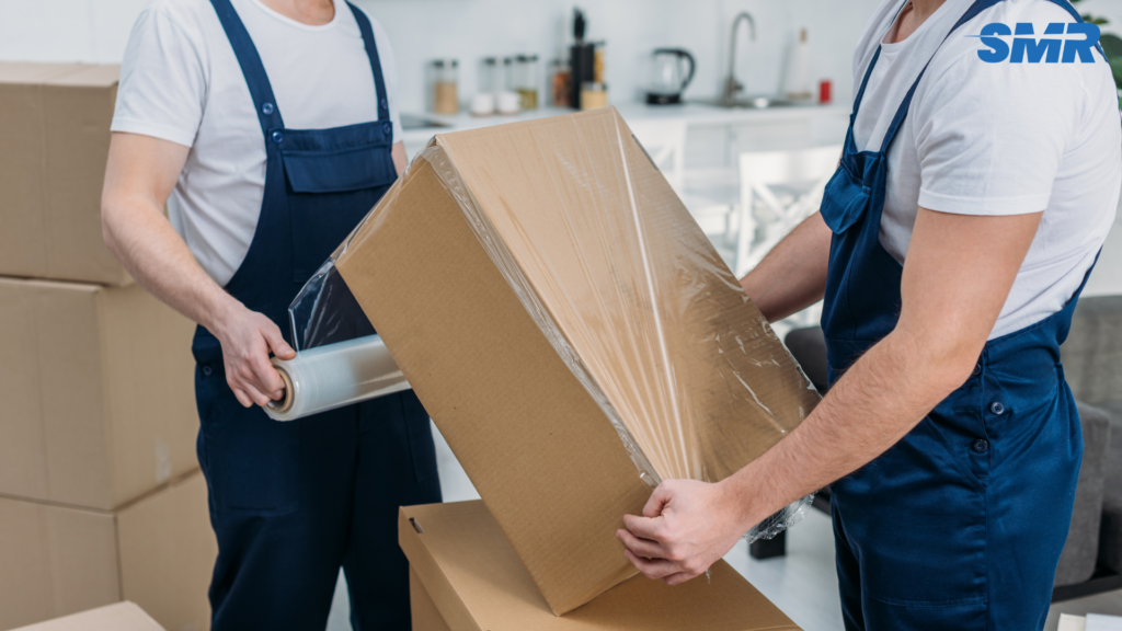 house removals Woolwich professional movers loading furniture van