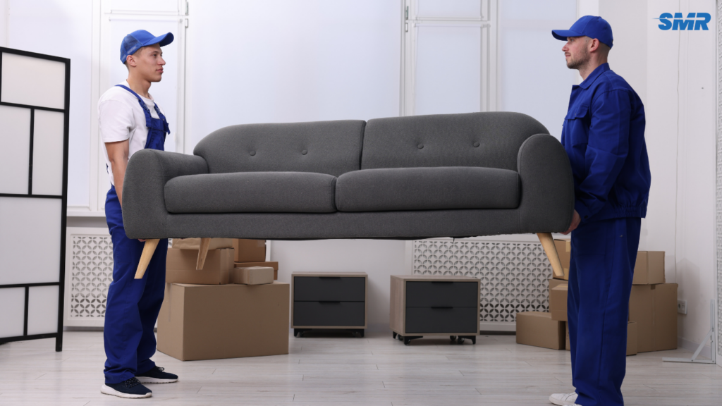 Man with a van in Woolwich moving a large sofa for a single-item removal