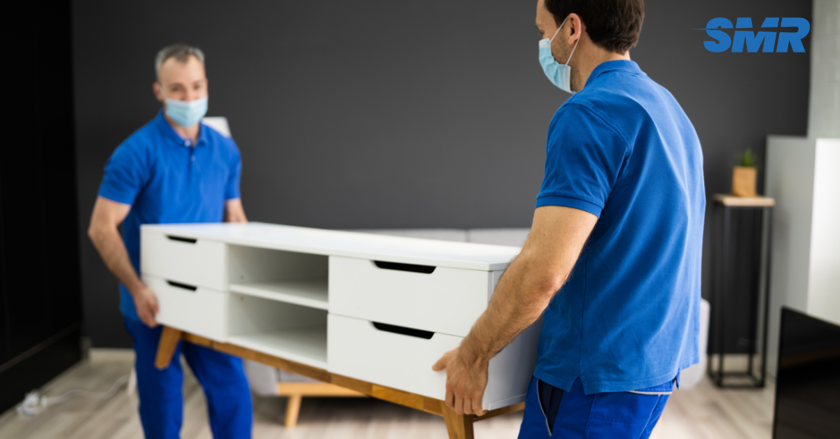 cheap man and van EN5 team loading furniture for house removals in EN5 London