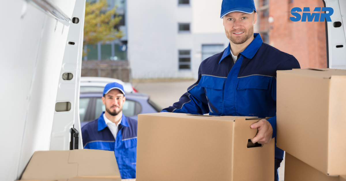 cheap man and van services EN2 London, movers loading furniture into a van in residential area