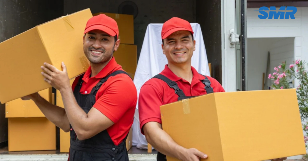 cheap man and van Hackney team loading furniture for house removals in Hackney London