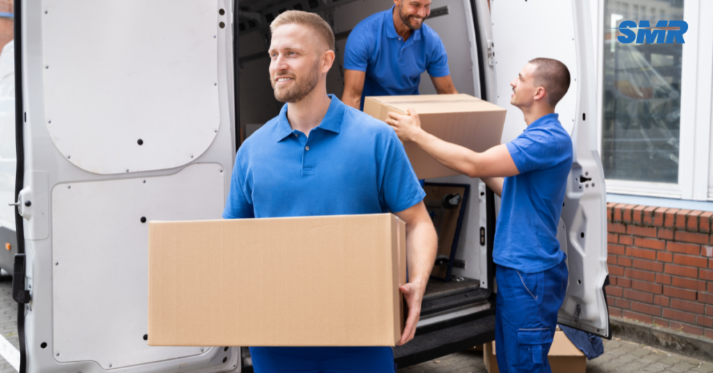 Professional man and van WD4 London movers carrying boxes for a local home move