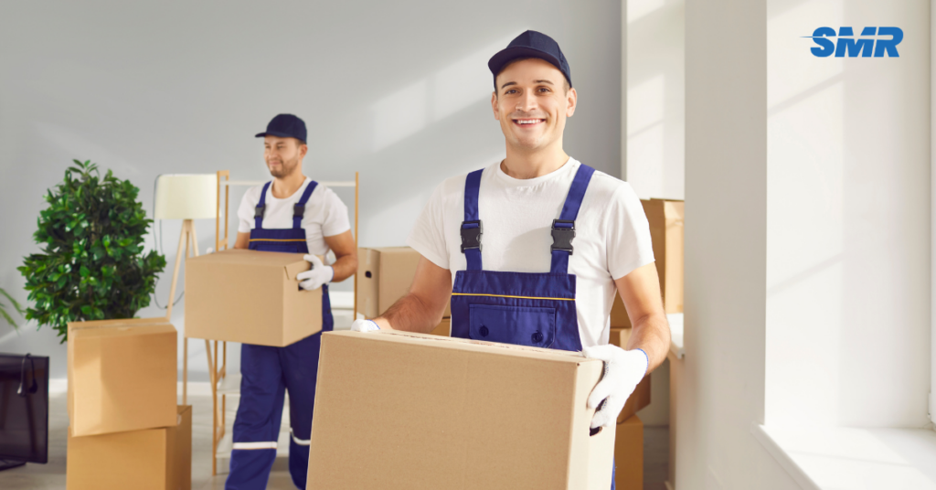 Affordable man and van W4 movers carrying boxes during a flat removal