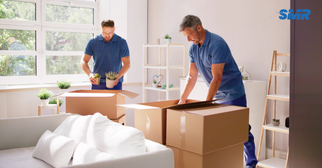 Office removals Acton team moving business furniture and packed office boxes