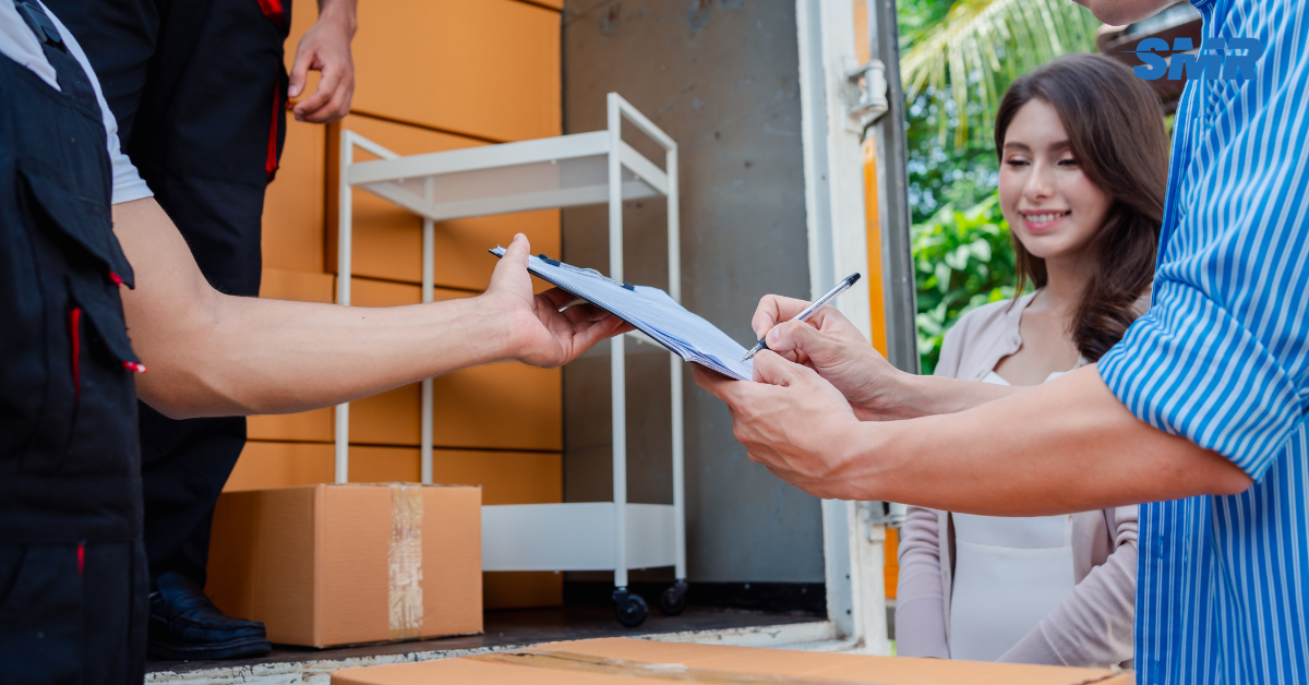 Movers handling protected furniture and packed boxes during a Dartford house move