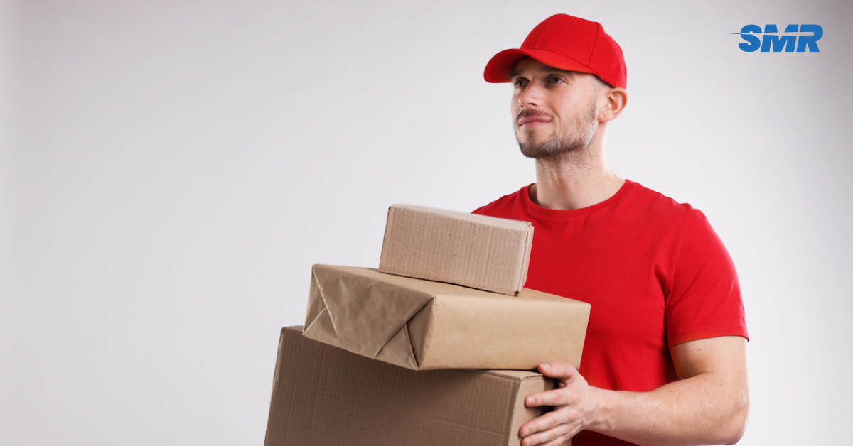 Movers transporting furniture and boxes during a flat move in Ealing W5
