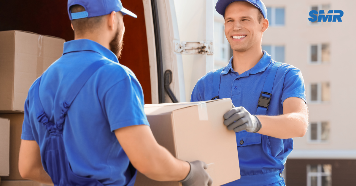 Movers handling wrapped furniture and packed boxes during a Dartford house move