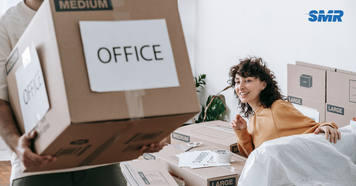 Movers handling wrapped furniture and packed boxes during an Elephant and Castle flat move