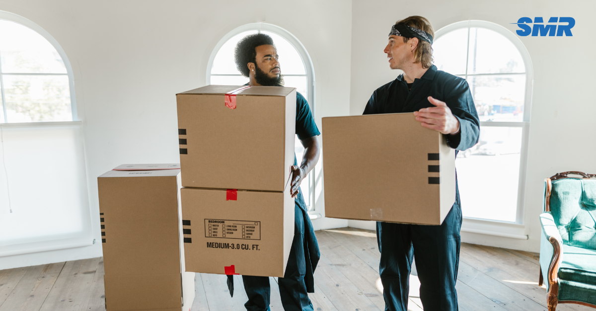 Movers handling wrapped furniture and packed boxes during an Eltham house move