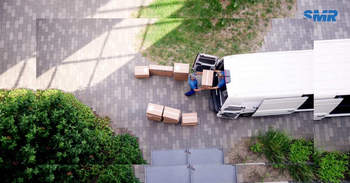 Movers handling wrapped furniture and packed boxes during a Finsbury house move