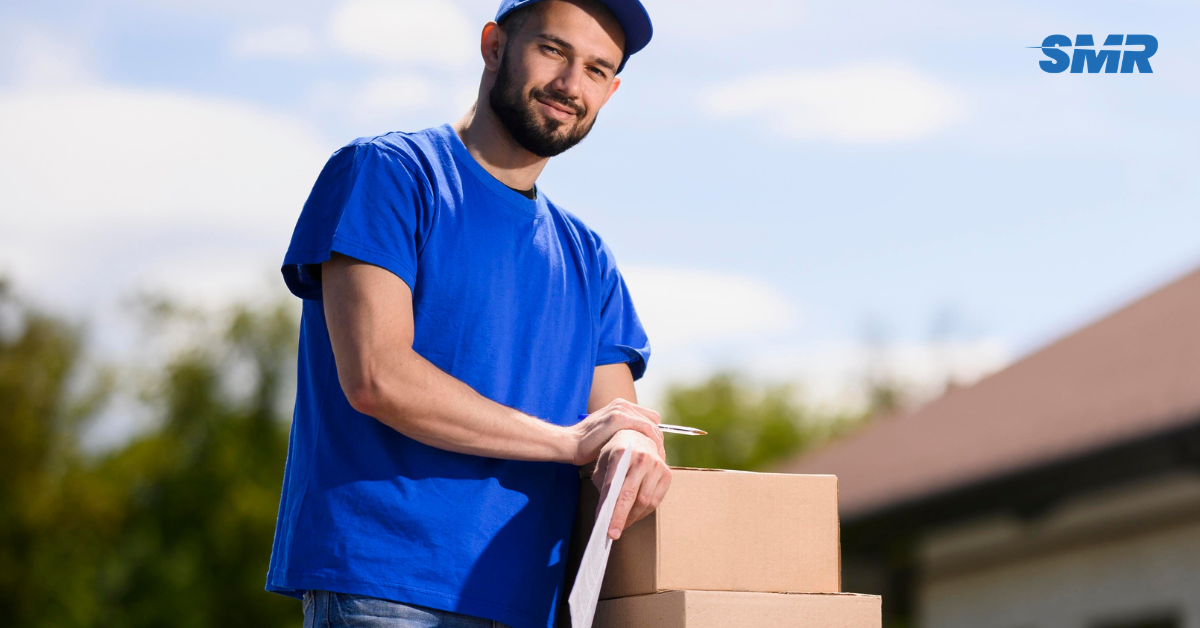 Movers handling wrapped furniture and packed boxes during an Enfield house move