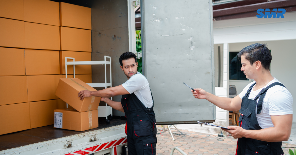 Movers loading single-item furniture into a van in Bethnal Green