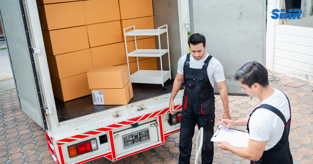 Movers carrying desks and office equipment for a Bethnal Green office move