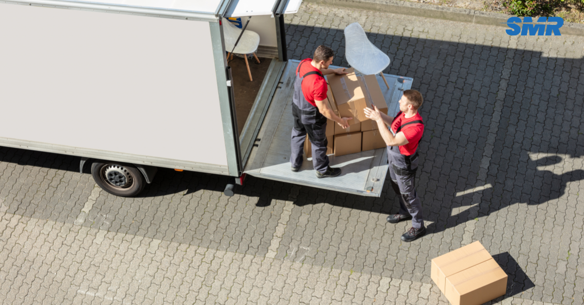 A professional Man and Van team in Brixton loading boxes into a van