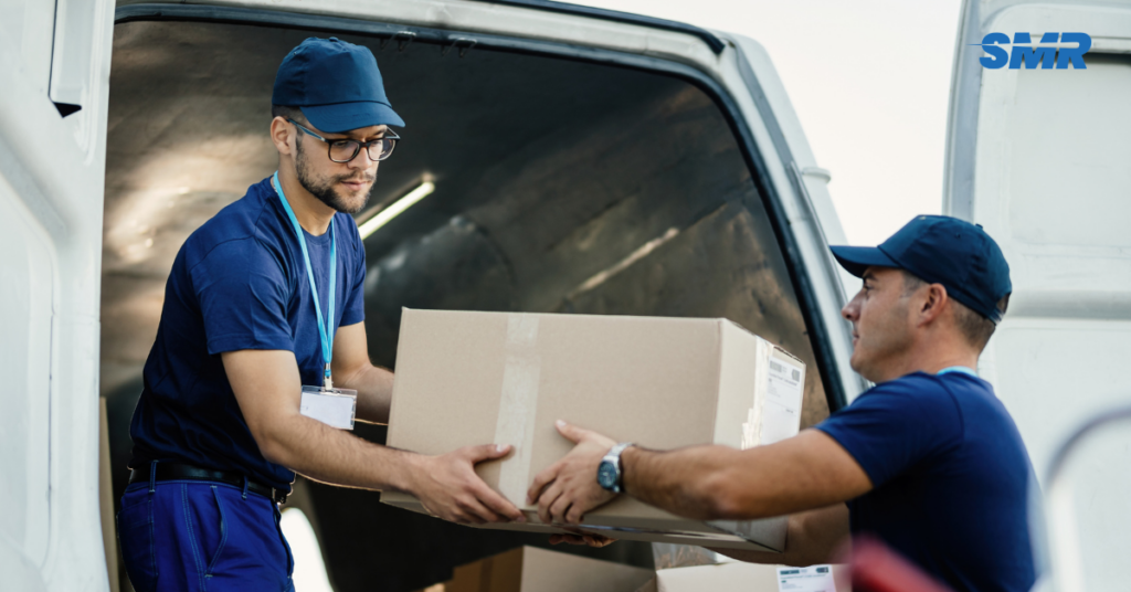 Man and Van Newham team loading moving boxes into a removal van
