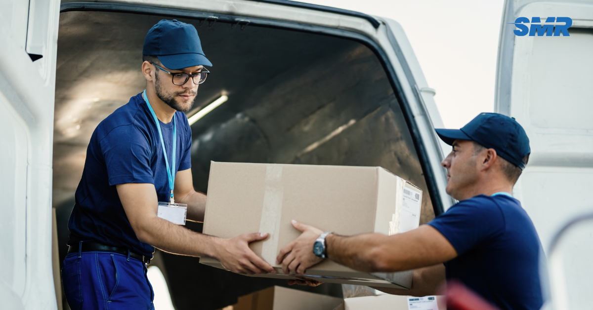 Professional man and van movers loading boxes in RM6 London