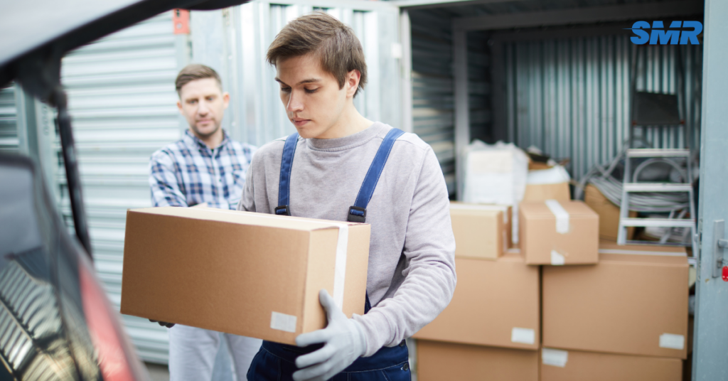 Flat and office removals Muswell Hill movers carrying packed boxes