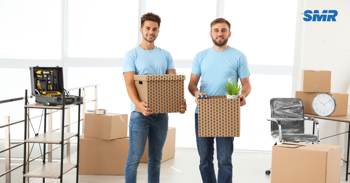 Professional Man and Van SE25 London movers loading boxes and furniture outside a home