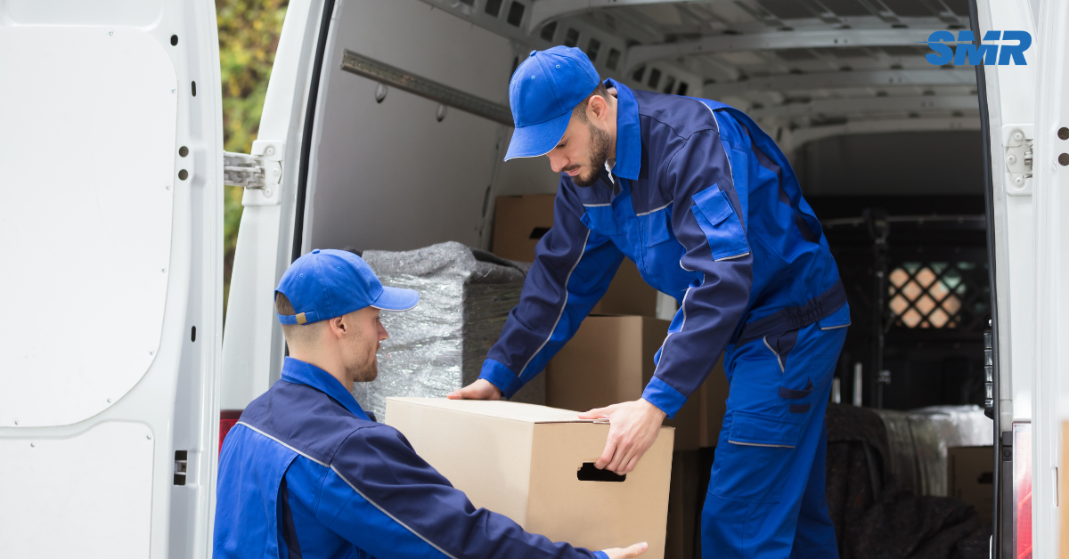 man and van RM12 London movers loading furniture into van