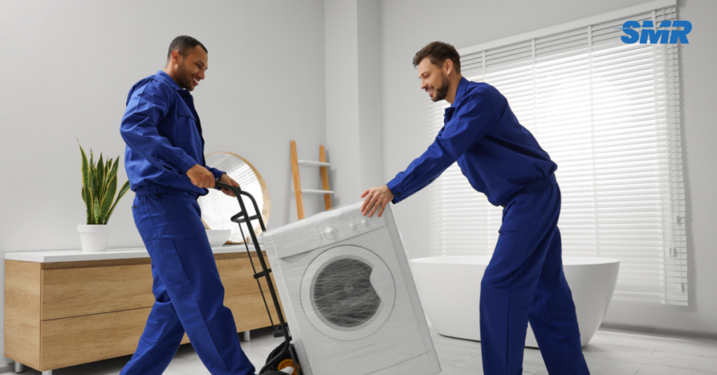 Flat removals Park Royal movers carrying wrapped boxes from an apartment