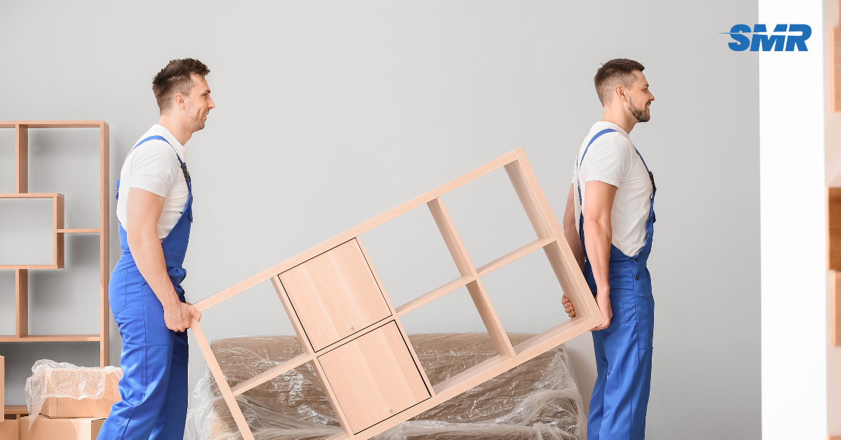 Professional Man and Van SE27 London movers loading boxes and furniture outside a home