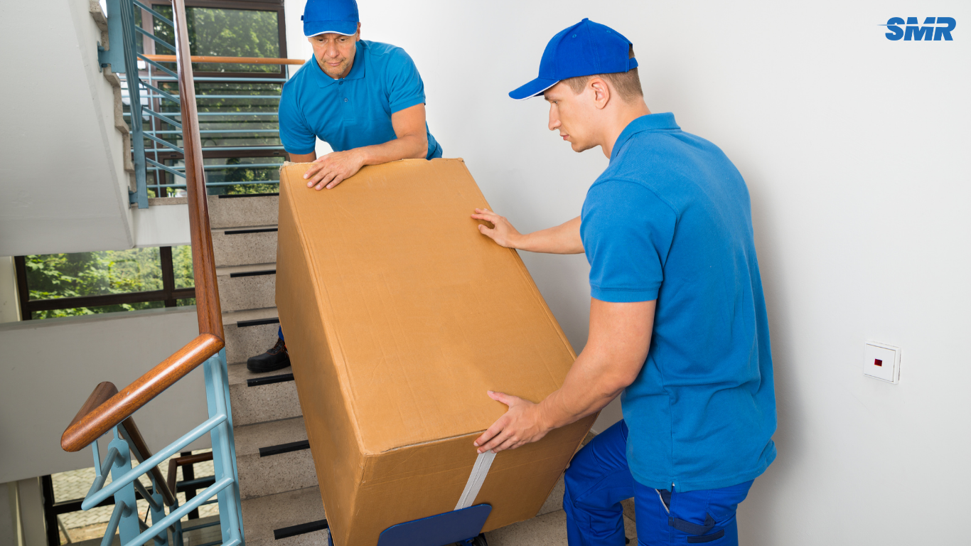Professional Homerton movers loading furniture into a van