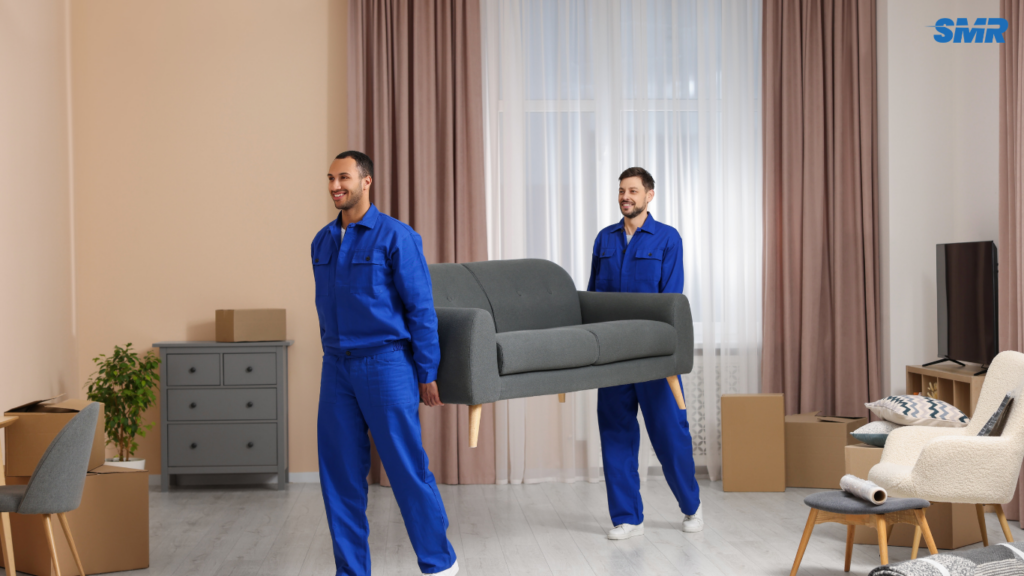 Movers transporting sofa and flat-pack furniture