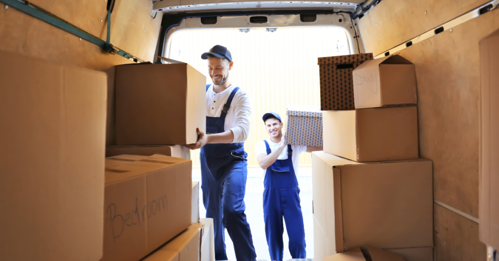 Cheap man and van Barnet with removal van and movers loading boxes outside a home