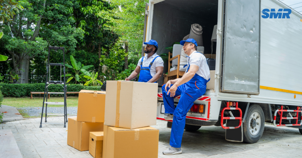 Man and Van NW7 London movers loading boxes into a van outside a residential property