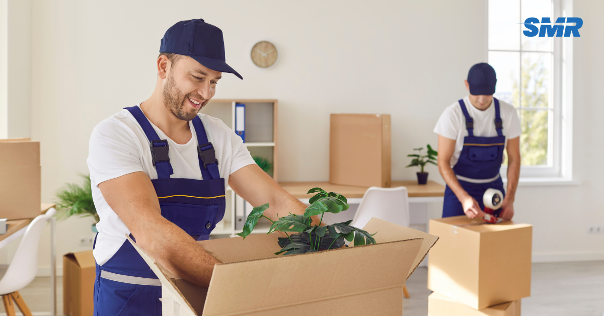 Sureman Removals team helping with an office relocation in RM17 London, moving packed office boxes, chairs and business equipment safely.