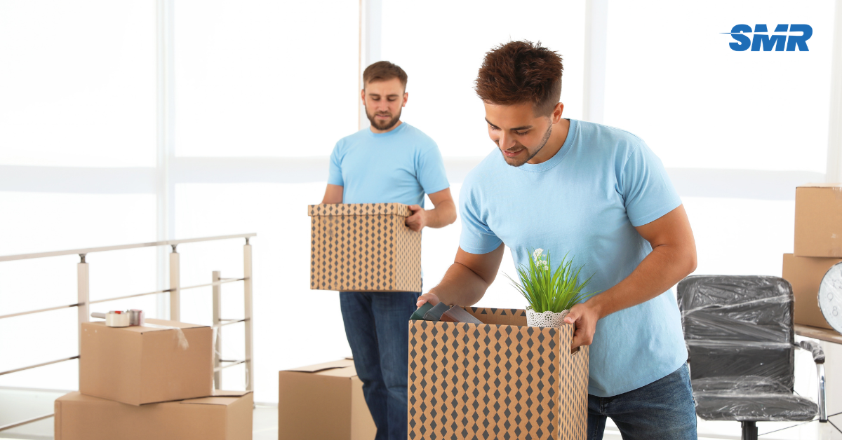 Man and Van RM15 London removals team moving wrapped boxes from a local home