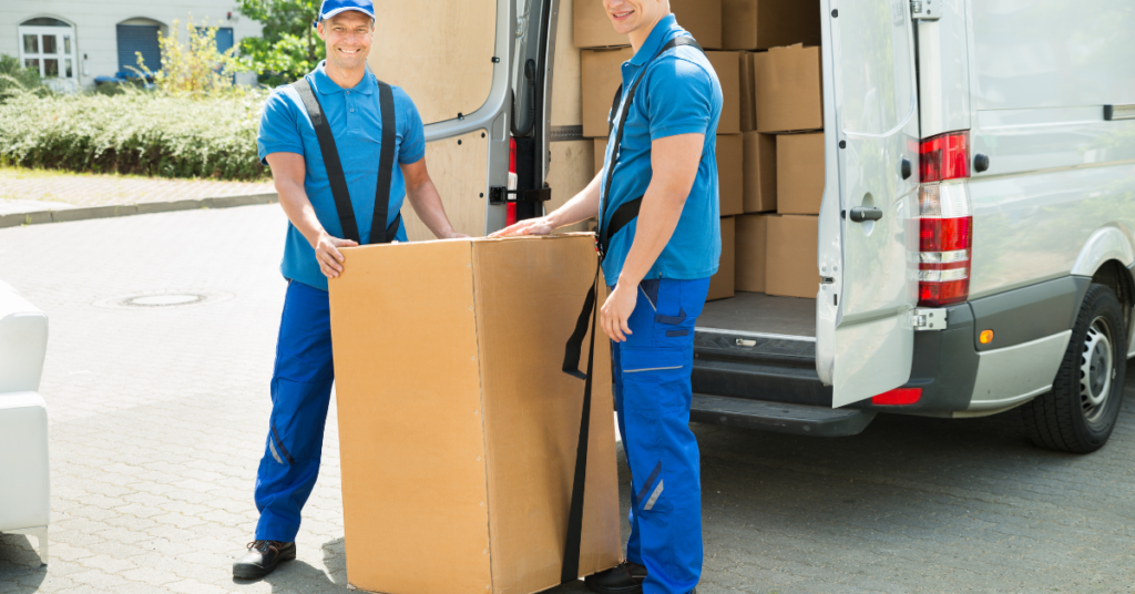 Sureman Removals man and van TW5 team loading boxes outside a home in Heston
