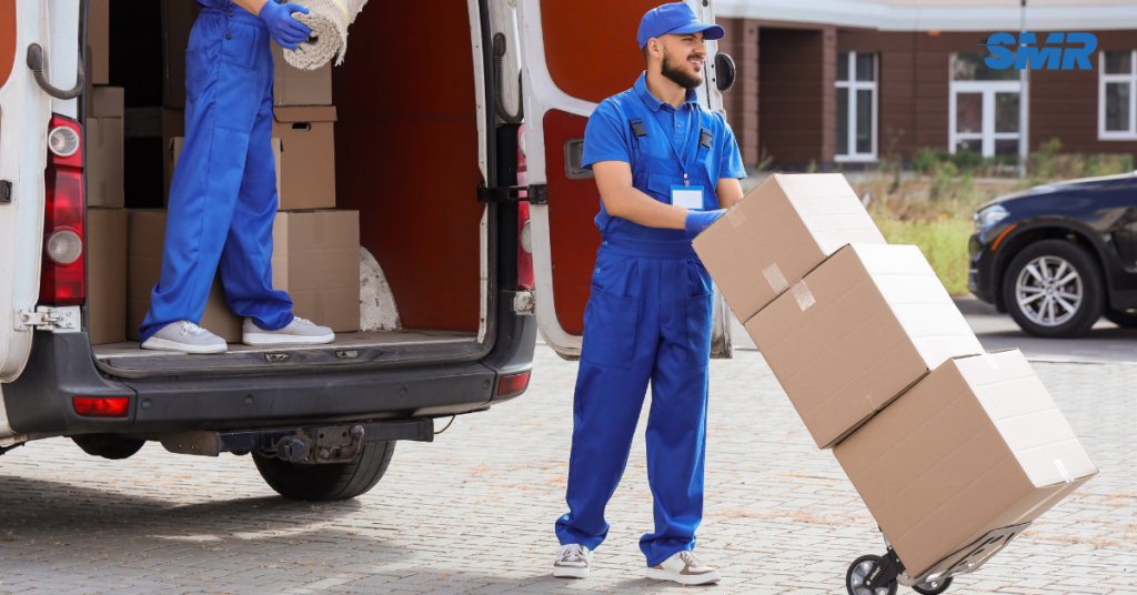 Man and Van W2 London movers loading boxes into a van outside a residential property