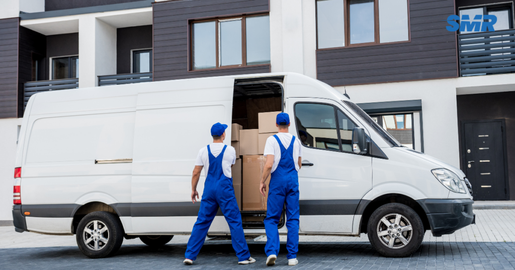 Man and Van W3 London movers loading boxes into a removals van