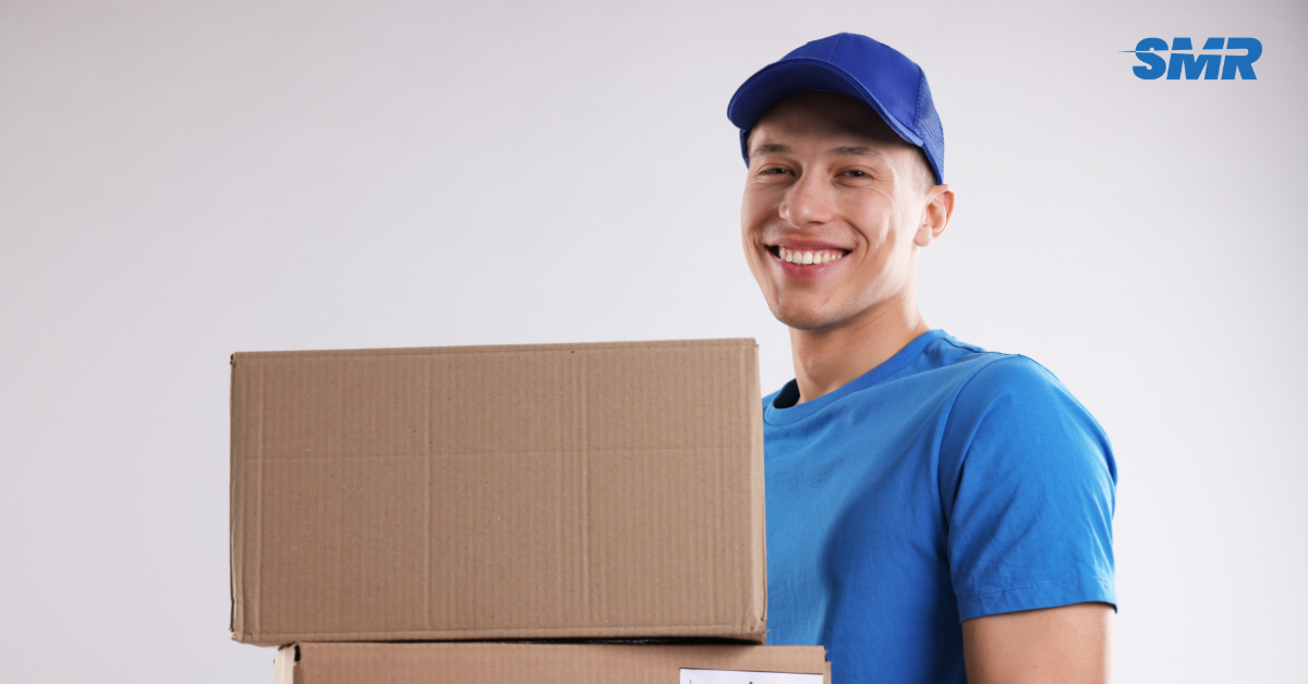 Professional Man and Van SE12 London movers loading boxes and furniture outside a home