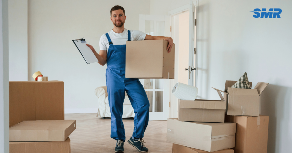 Man and Van SW10 London removals team loading wrapped boxes into a clean moving van