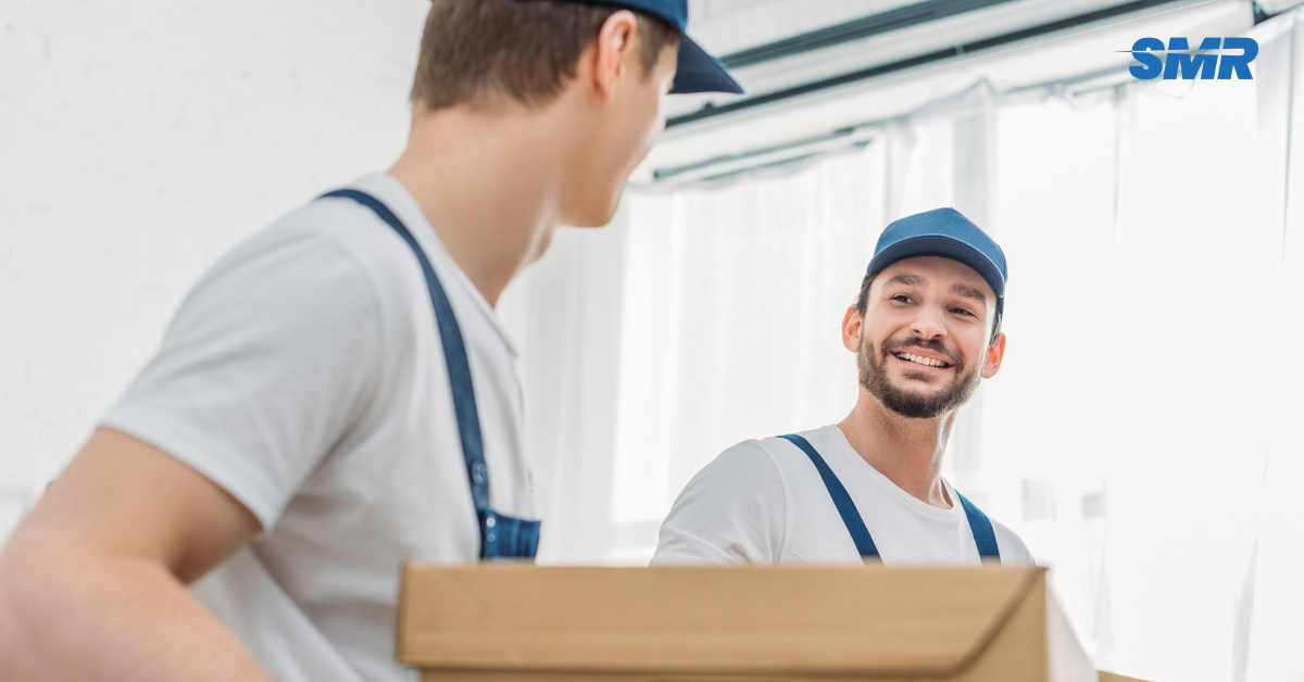 Professional Man and Van SE13 London movers loading boxes and furniture outside a home