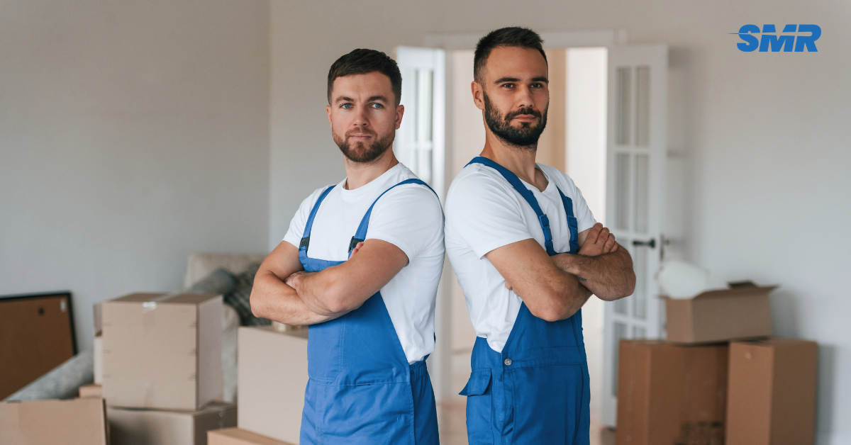 Professional Man and Van SE15 London movers loading boxes and furniture outside a home