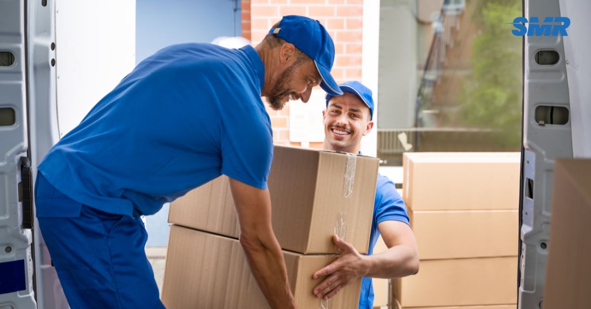 Professional Man and Van SE17 London movers loading boxes and furniture outside a home
