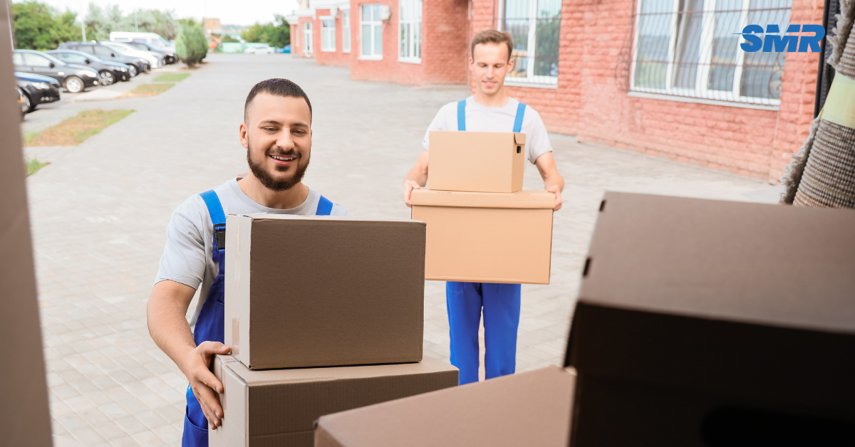 Man and Van DA15 London removals team moving wrapped boxes from a local home