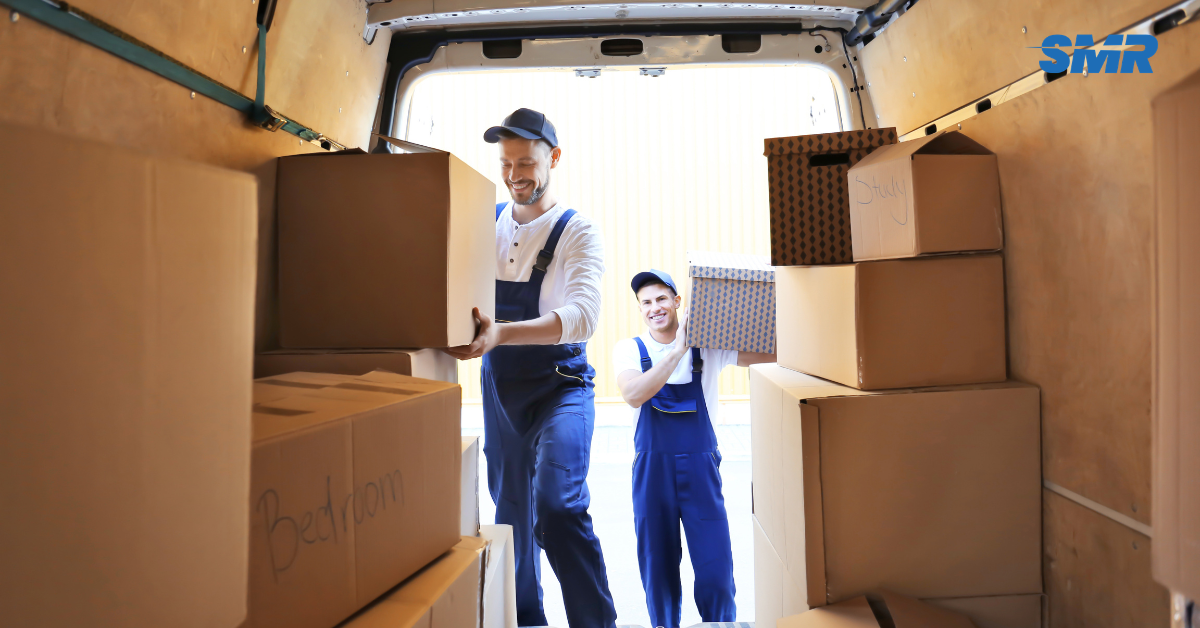 Professional Man and Van SE22 London movers loading boxes and furniture outside a home