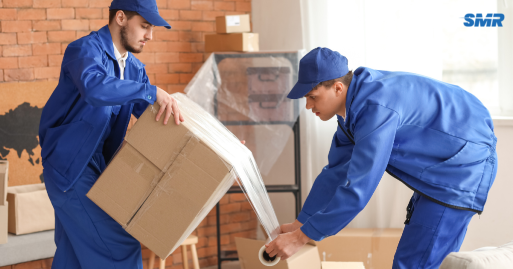 Man and Van Forest Gate E7 removals team moving furniture into a property