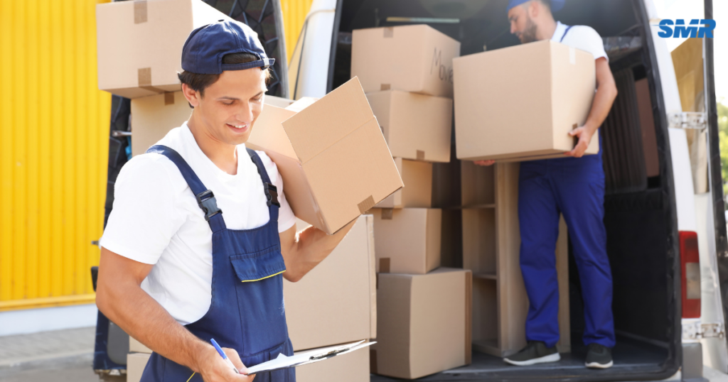 Man and Van Golders Green movers loading furniture and moving boxes into a removals van